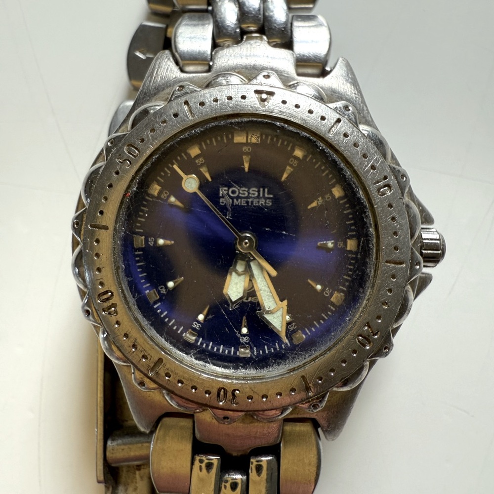 Ladies Fossil watch with blue face and silver band - needs new battery